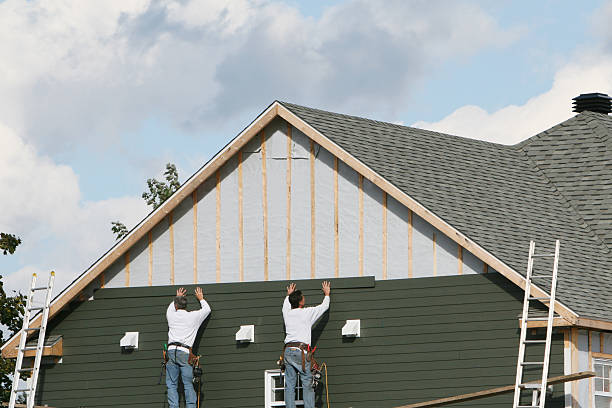 Professional Storm Damage Siding Repair technician working in Grapeville, PA